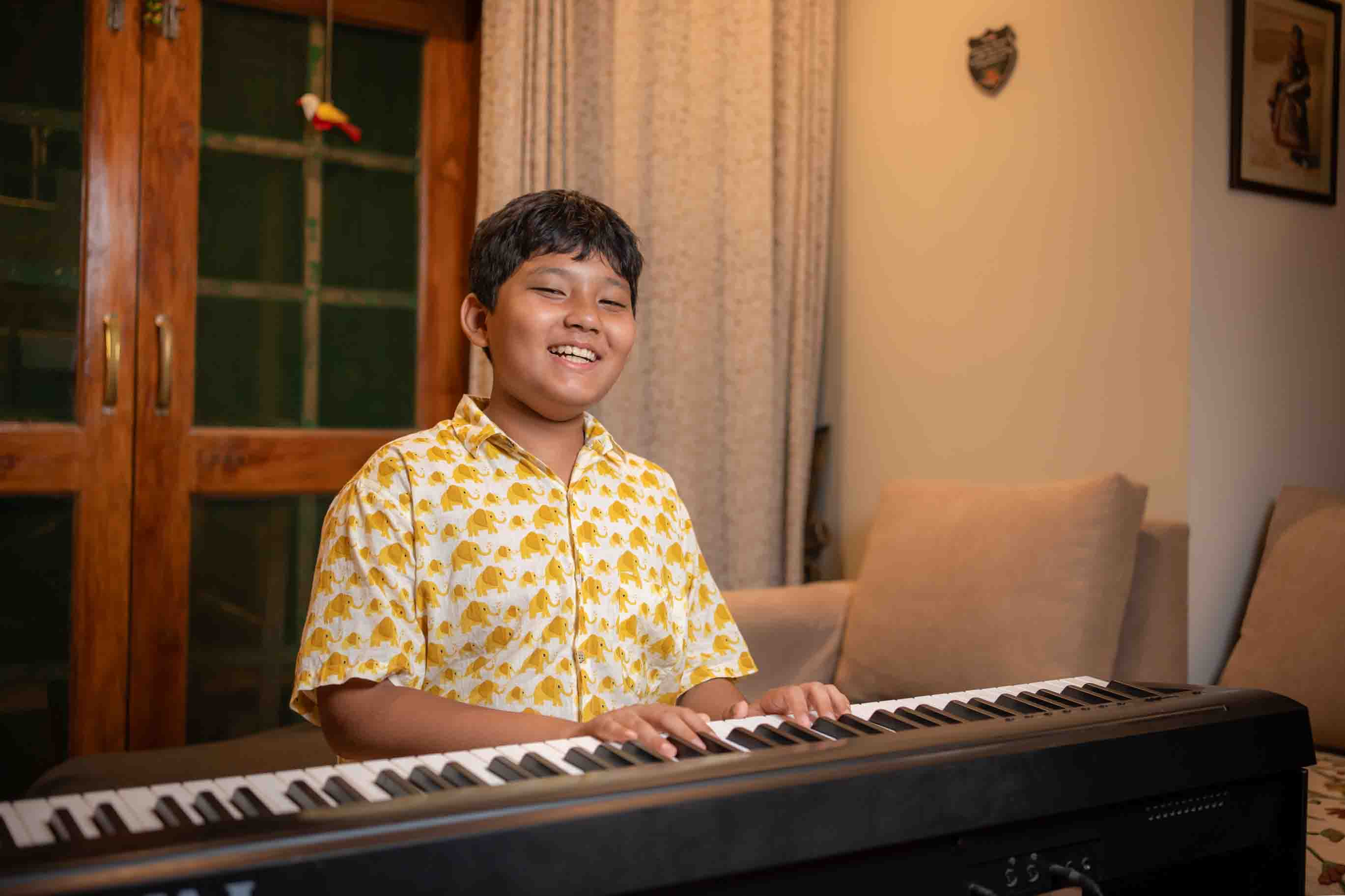 Student performing piano at a recital