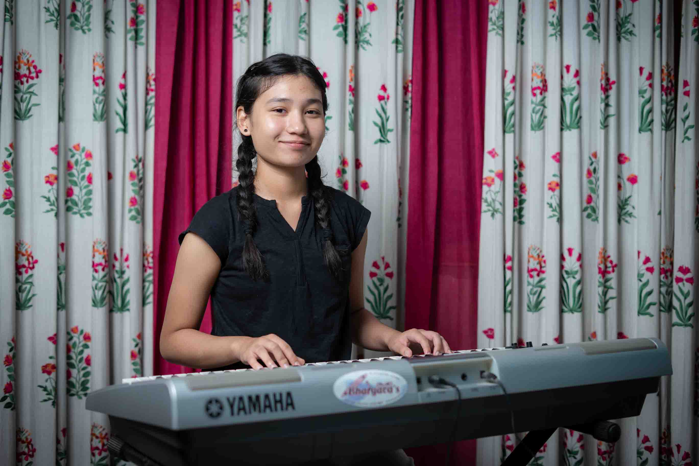 Student playing keyboard at Doon Harmony
